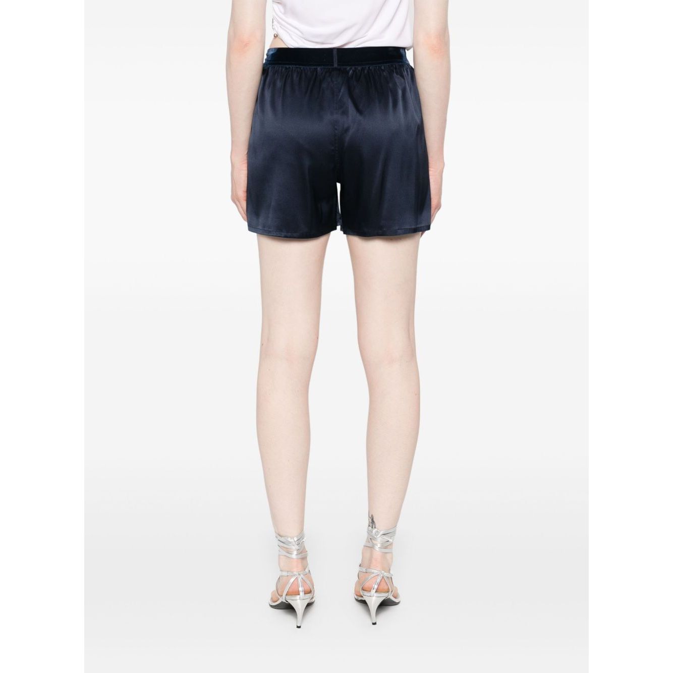 Model wearing navy blue silk Tom Ford Shorts Blue with elasticated logo waistband, rear view