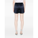Model wearing navy blue silk Tom Ford Shorts Blue with elasticated logo waistband, rear view