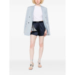 Model wearing Tom Ford Shorts Blue with navy elasticated waistband, paired with a light blazer and silver heels.