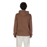 Rear view of Underclub Brown Cotton Hoody worn by model, showcasing ribbed cuffs and hem, adjustable hood, made from 100% cotton.