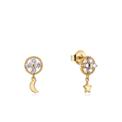 Gold earrings with moon and star charms, encrusted with diamonds, perfect for any occasion.