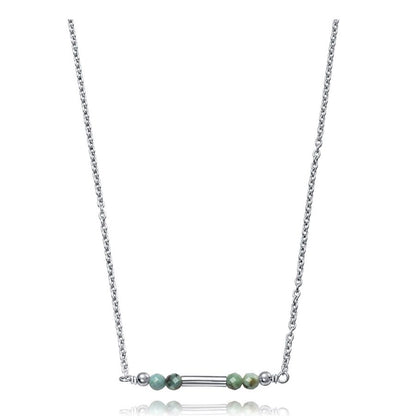 Elegant silver necklace with turquoise beads and minimalist design on a white background.
