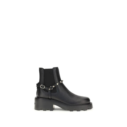 Valentino Garavani Black Calf Leather Bos Taurus Ankle Boots with studs and elastic inserts on a white background.