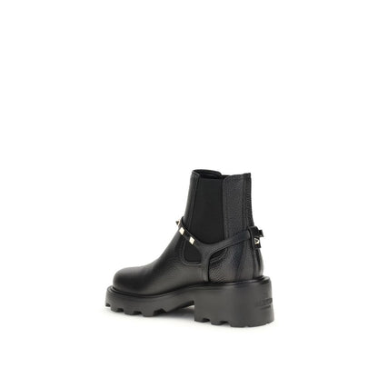 Valentino Garavani Black Calf Leather Bos Taurus Ankle Boots with metal studs and side elastic inserts, AW25 collection.