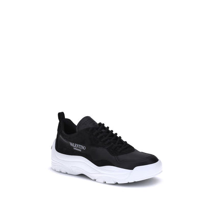 Valentino Garavani Black Calf Leather Bos Taurus Chunky Sneakers featuring embossed logo, lace-up closure, and smooth suede detail.