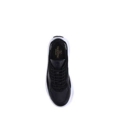 Top view of Valentino Garavani Black Calf Leather Bos Taurus Chunky Sneakers with logo on tongue and preformed sole.
