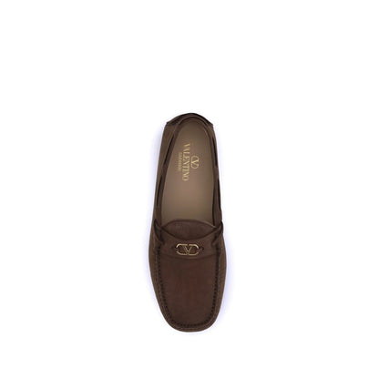 Top view of Valentino Garavani Brown Rubber Slip-On Loafers with VLogo plaque and notched rubber sole.