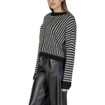 Woman wearing Vero Moda Black And White Recycled Polyester Sweater from the Fall/Winter collection, featuring sustainable knitwear fashion.