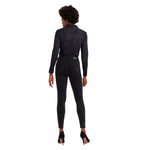 Back view of model wearing Vero Moda Black Cotton Bodysuit paired with dark jeans and high heels