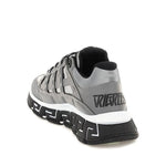 Versace Trigreca Sneaker featuring leather details, rubber sole, and logo design, made in Italy.