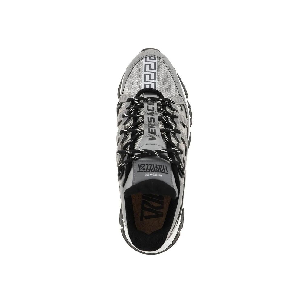 Top view of Versace Trigreca Sneaker featuring fabric, leather details, rubber sole, and lace-up with logo, made in Italy.