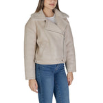 Woman wearing a Vila Clothes Beige Artificial Leather Jackets & Coat with shearling collar and asymmetrical zip.
