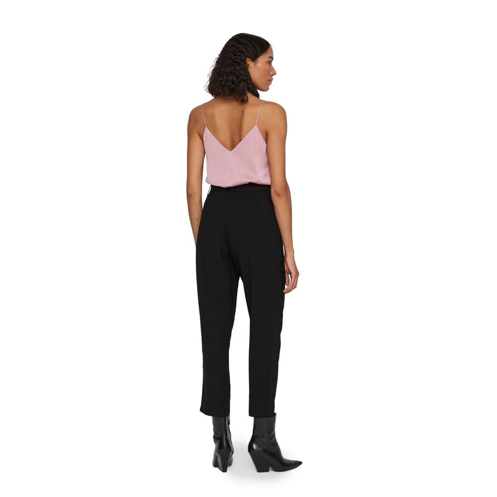 Woman wearing Vila Clothes Black Viscose Cropped Pants with pink top and black boots.