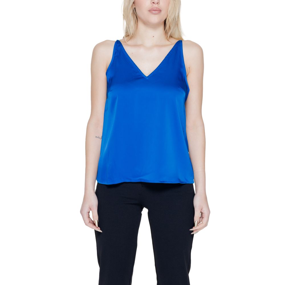 Woman wearing Vila Clothes Blue Polyester Top with V-neck and adjustable straps; lightweight and stylish for a modern look.