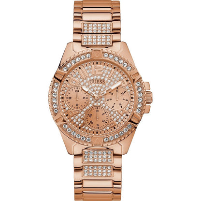Rose gold GUESS women's watch with crystal accents and quartz movement, featuring a mineral dial and 40 mm case, water resistant 5 ATM