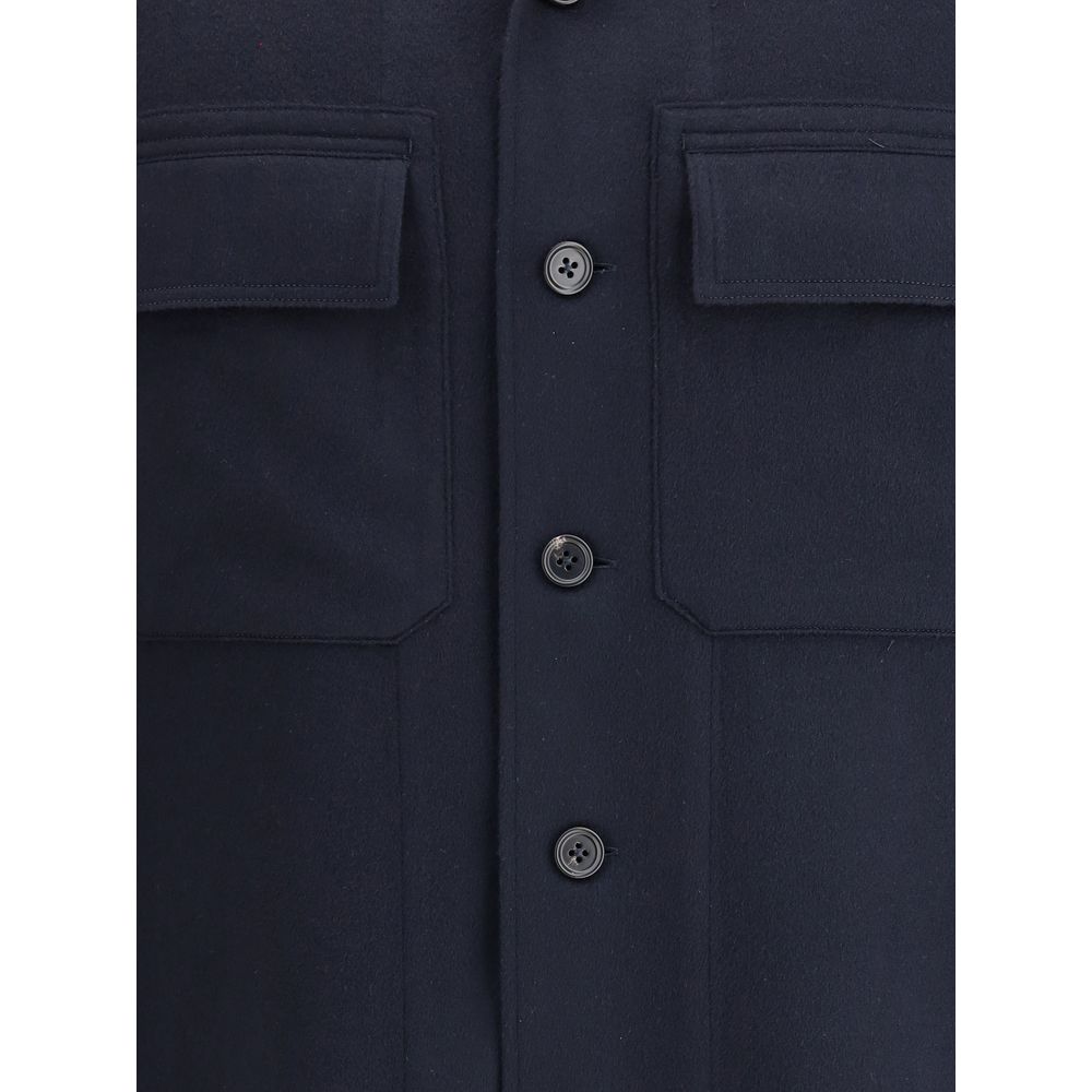 Close-up of ZEGNA Blue Cashmere Coat buttons and pocket details, highlighting fine tailoring and contemporary elegance.